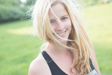 Attractive young woman enjoying her time outside in park