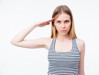 Fototapeta premium Portrait of a young cute woman saluting