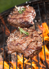 Beef steaks on grill