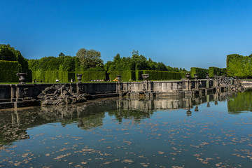 Fototapeta premium Fountain in beautiful gardens of famous Versailles palace.