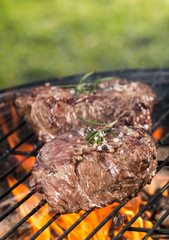 Beef steaks on grill