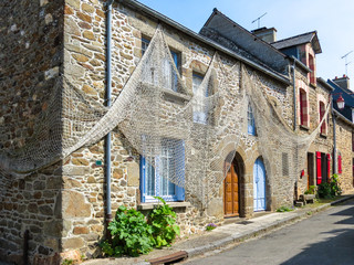Fototapeta na wymiar Fishing networks on the rural bildings, Brittany, France