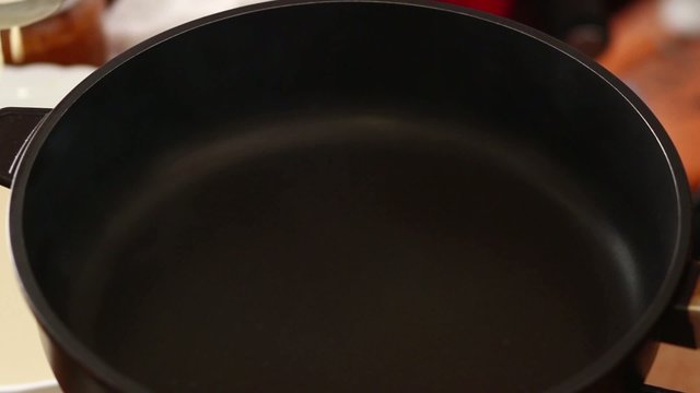 HD 1080 closeup crepe making pouring dough into frying pan