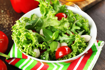 fresh vegetable salad in bowl on table close up