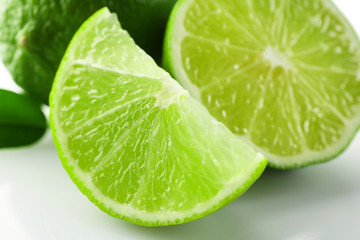 Fototapeta na wymiar Sliced fresh limes, closeup