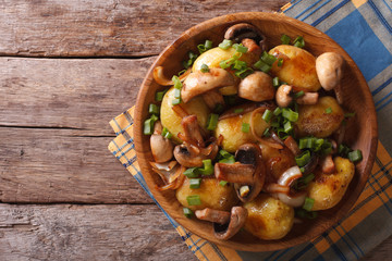 Homemade Food: Potatoes with mushrooms. top view
