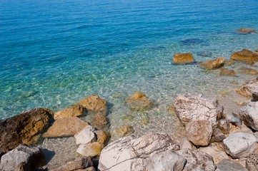 Fototapeta na wymiar Beautiful beach with big stones in Podgora, Croatia
