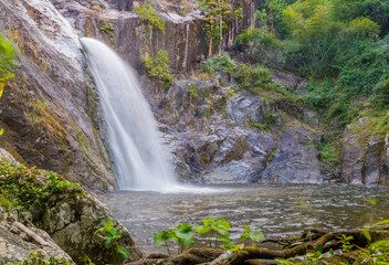 Fototapeta na wymiar Waterfall in deep rain forest jungle. (Mae Re Wa Waterfalls Moko