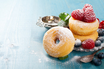 Morning breakfast with mini donuts and berries