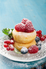 Morning breakfast with mini donuts and berries