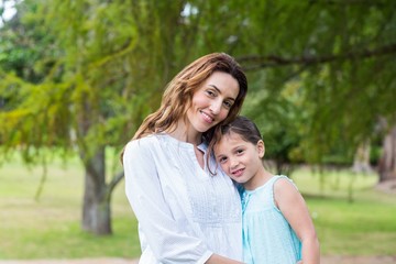 Fototapeta premium mother and daughter smiling at the camera