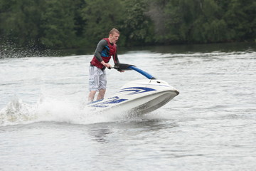 Action Photo Man on jet ski.