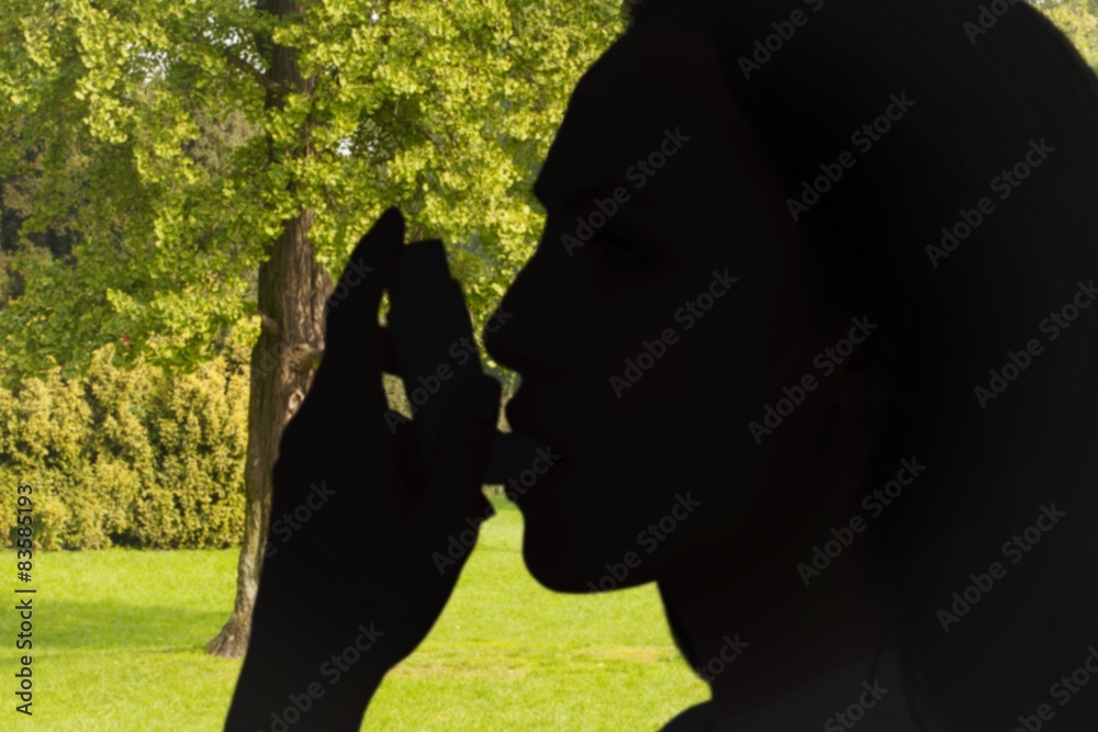 Poster Composite image of asthmatic brunette using her inhaler 