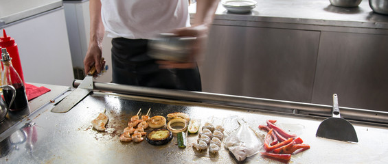 chef restaurant with grilled foods and a sole fish