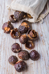 Nutshells of soapnuts in a cotton bag for laundry