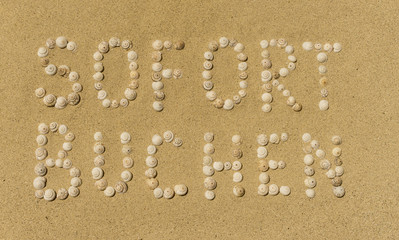 Sofort buchen in Sand geschrieben