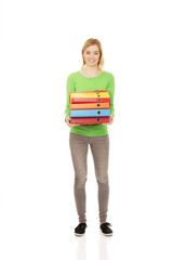 Young woman with heavy binders.