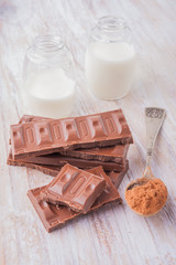 Milk chocolate, cocoa and milk bottle