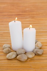 Fototapeta na wymiar Candles with pebbles