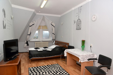 Double hotel room with a portrait of the Russian poetess Anna Ak