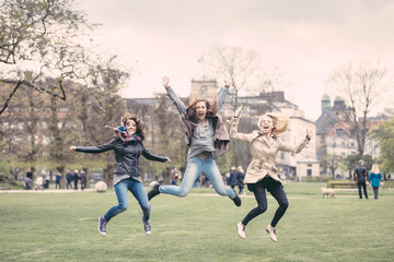 Group of women jumping at park