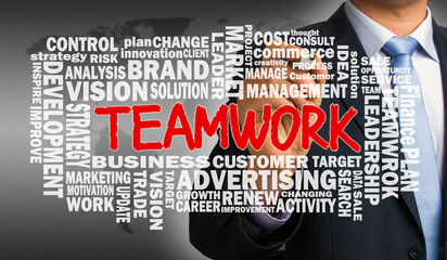 teamwork with business word cloud hand drawn by businessman