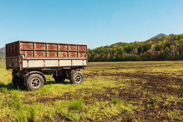 Countryside landscape with wagon for agriculture