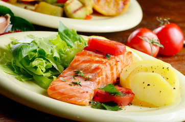 Fried salmon fillet with vegetables