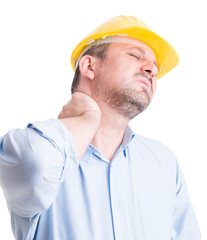 Back neck pain gesture by architect or engineer