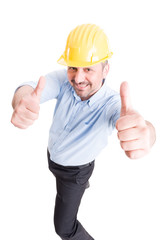 Smiling architect showing thumbs up