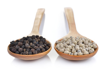 peppercorn in the wooden spoon on white background