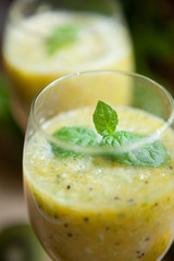 Smoothie with kiwi, lime, orange and mint