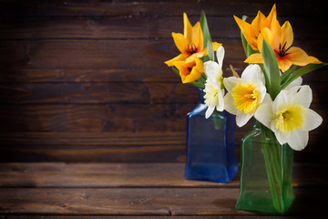 Background with fresh narcissus and tulips