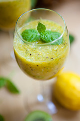 Smoothie with kiwi, lime, orange and mint