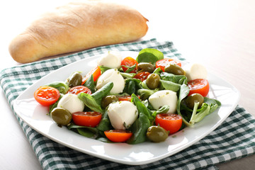 Caprese salad tomato, mozzarella and olives
