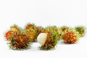 peeled rambutan on white background