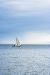 Obraz premium Sailing boat at an open sea