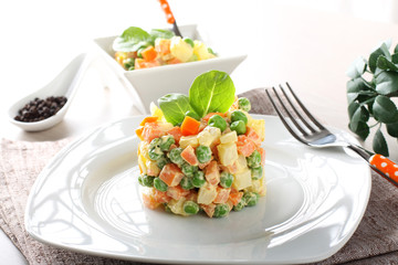 Russian salad with peas, carrots, potatoes and mayonnaise - 83600781