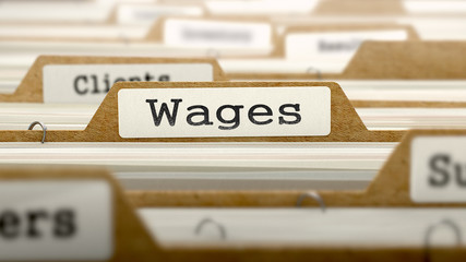 Wages Concept with Word on Folder.