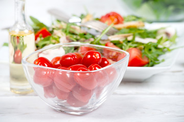 Small tomatoes in a glass jar