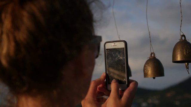Woman Taking Picture Using a Smartphone