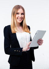 Fototapeta premium Smiling businesswoman using tablet computer
