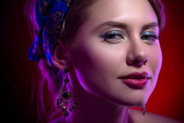 Obraz premium Beauty portert beautiful model in a bright scarf on her head