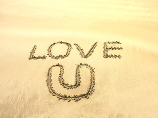 text writing on sand beach