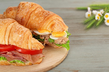 croissant sandwiches on a cutting board