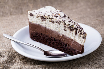 Chocolate dessert on wooden background.
