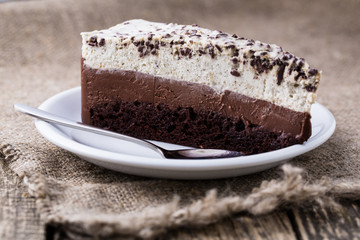 Chocolate dessert on wooden background.
