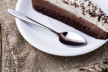 Chocolate dessert on wooden background.