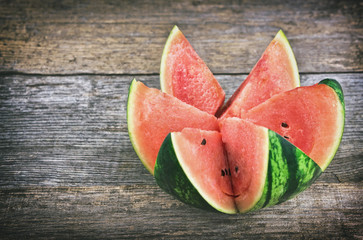 Fresh watermelon on rustic wooden table