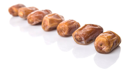 Date fruits over white background